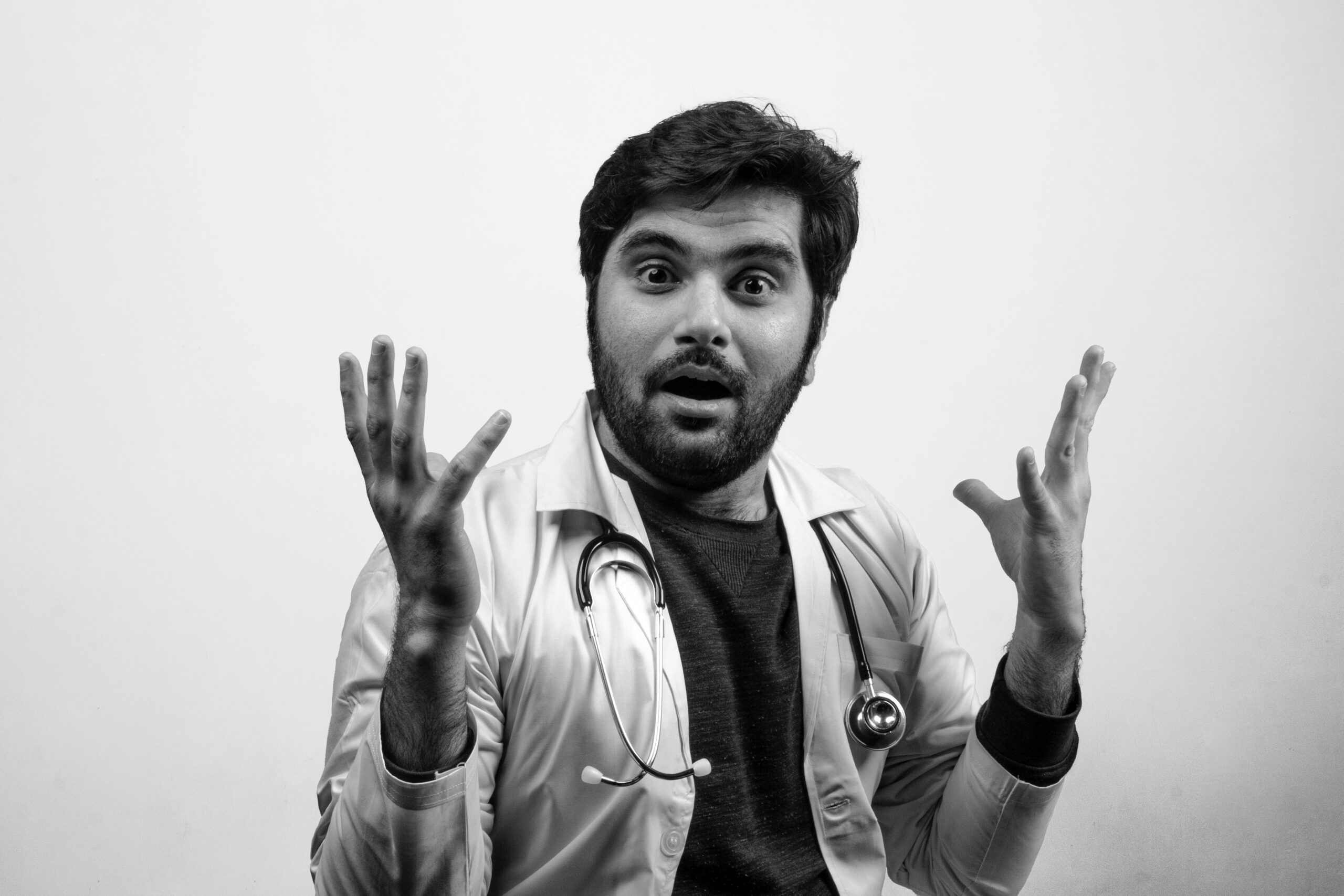 A doctor with surprised expressions strange gestures - Black and White